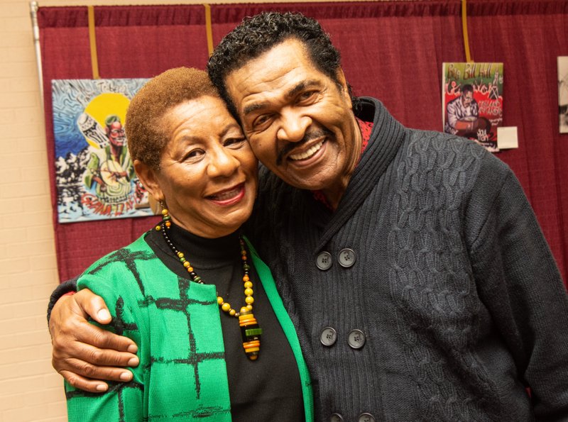 Pine Bluff Mayor Shirley Washington gets a hug from bluesman Bobby Rush in this 2018 photo. Rush, who grew up partly in Pine Bluff, is an international blues star who will live stream a concert for fans on Facebook Live at 2 p.m. Tuesday. (Democrat-Gazette file photo/Cary Jenkins)
