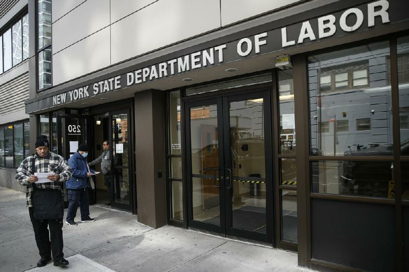 Visitors to a New York Department of Labor office are turned away at the door Wednesday because of coronavirus closures in New York City.
(AP/John Minchillo)