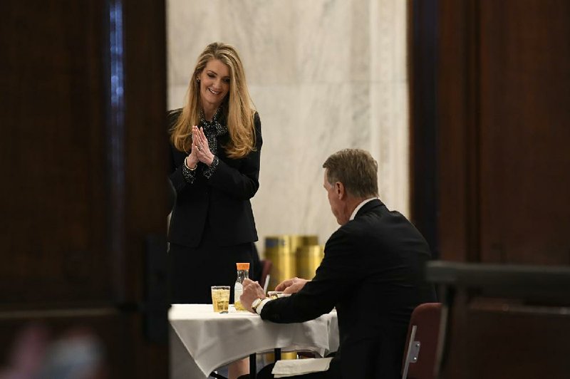 Georgia U.S. Sens. Kelly Loeffler and David Perdue chat Friday after arriving on Capitol Hill for a Republican policy luncheon.
(AP/Susan Walsh)