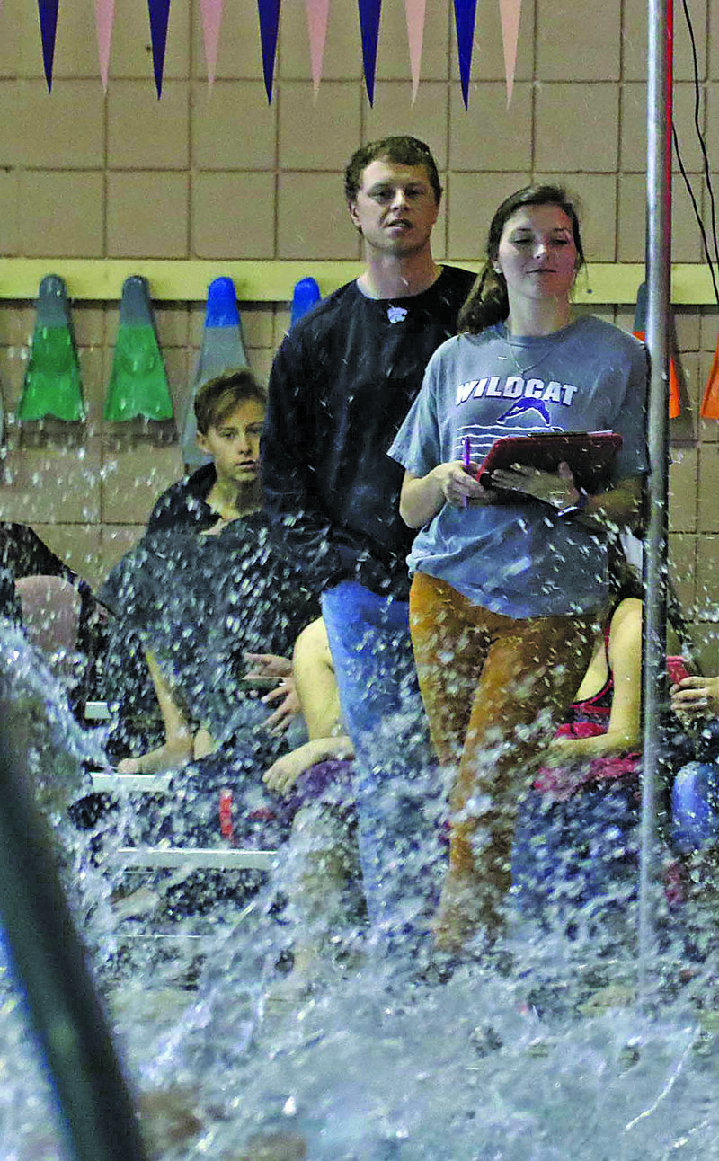 El Dorado swim coach Courtney McDiarmid Canady watches her athletes at a high school meet. Canady, a former Lady Wildcat swimmer, returned to coach at her alma mater this year. She is one of 16 former El Dorado athletes currently coaching in the school's athletic program.