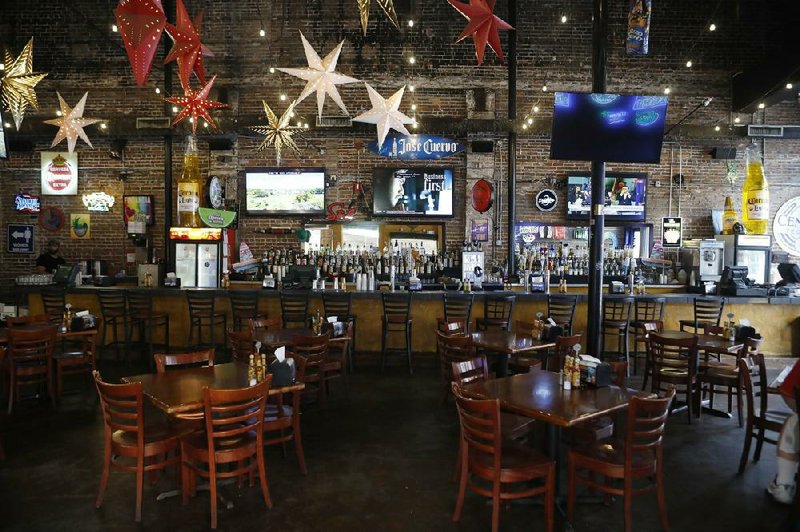 The Tequila Mexican Restaurant sits nearly empty last week in the Ybor City neighborhood in Tampa, Fla. The city of Tampa delivered iars to local bars and restaurants informing them to expect an announcement of mandated closures to help prevent the spread of the coronavirus. (AP/Octavio Jones) 
