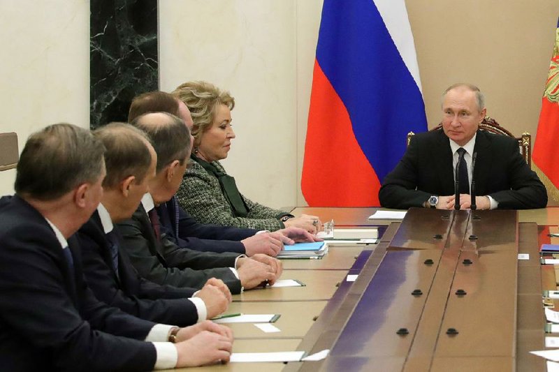 Russian President Vladimir Putin leads a meeting of his security council Friday in Moscow.
(AP/Mikhail Klimentyev)