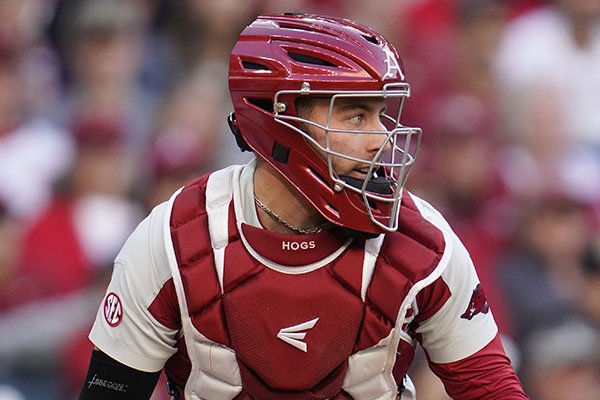 Arkansas catcher Casey Opitz (12) looks to throw after picking up a loose ball during an NCAA baseball game against Oklahoma on Friday, Feb. 28, 2020 in Houston. (AP Photo/Matt Patterson)


