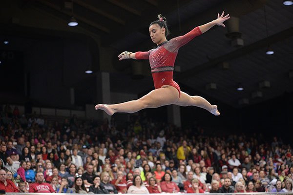 Arkansas' Sophia Carter competes Friday, Feb. 7, 2020, in the beam portion of the Razorbacks' meet with Georgia in Barnhill Arena in Fayetteville.