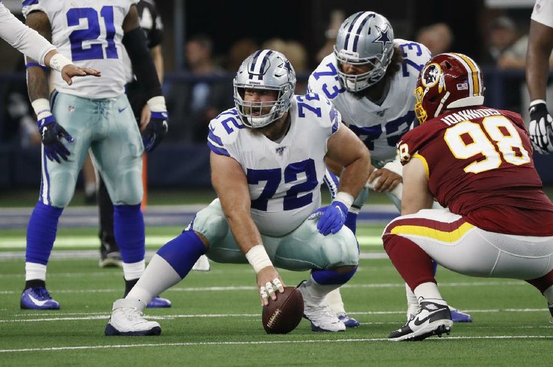 Dallas Cowboys center Travis Frederick (72) announced his retirement on Monday. Frederick, 29, a ve-time Pro Bowler, cited a nerve disorder that sidelined him for the 2018 season as a reason for retiring. (AP/Roger Steinman) 
