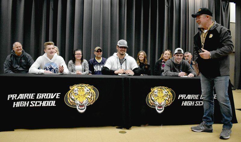 MARK HUMPHREY ENTERPRISE-LEADER Three Prairie Grove seniors, Jared Harger (left), Hayden Black and Cordelle Whetsell, signed national letters of intent to play college football for Winfield College, of Winfield, Kan., on Friday, Feb. 21, at the high school cafeteria once they were introduced by Prairie Grove head coach Danny Abshier.