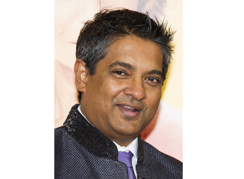 This Aug. 4, 2014 file photo shows chef Floyd Cardoz at "The Hundred-Foot Journey" premiere in New York. Cardoz, who competed on “Top Chef,” won “Top Chef Masters” and operated successful restaurants in both India and New York, has died of complications from the coronavirus, his company said Wednesday. He was 59. (Photo by Charles Sykes/Invision/AP, File)