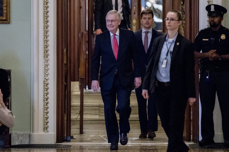 Senate Majority Leader Mitch McConnell of Ky. leaves the Senate chamber on Capitol Hill, Wednesday, March 25, 2020, in Washington. (AP Photo/Andrew Harnik)