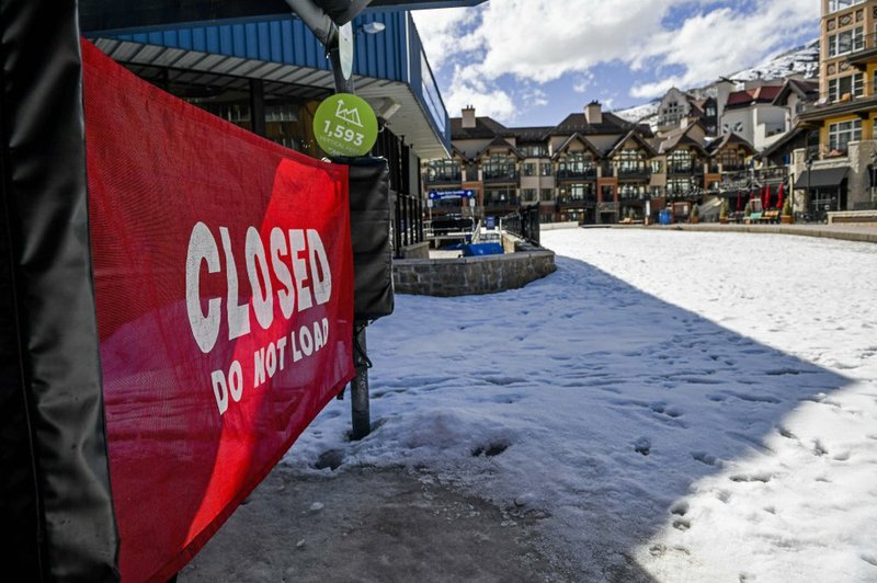 This Tuesday, March 24, 2020, photo shows a closed ski lift in Vail, Colo., after Vail Ski Resort closed for the season amid the COVID-19 pandemic. Ski resorts across the West that were shut down amid coronavirus fears are grappling with an economic “body blow" at a time when they normally would be welcoming hoards of spring break revelers. (AP Photo/Michael Ciaglo)