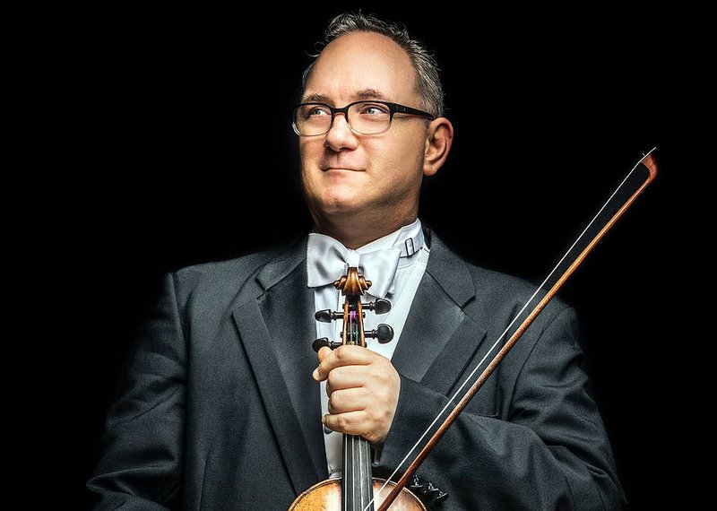FILE - Arkansas Symphony Orchestra co-concertmaster Drew Irvin