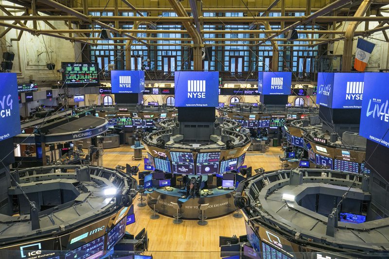 This photo provided by the New York Stock Exchange shows the unoccupied NYSE trading floor, closed temporarily for the first time in 228 years as a result of coronavirus concerns, Tuesday March 24, 2020. Global stocks and U.S. futures declined Thursday after the U.S. Senate approved a proposed $2.2 trillion virus aid package following a delay over its details and sent the measure to the House of Representatives. (Kearney Ferguson/NYSE via AP, File)