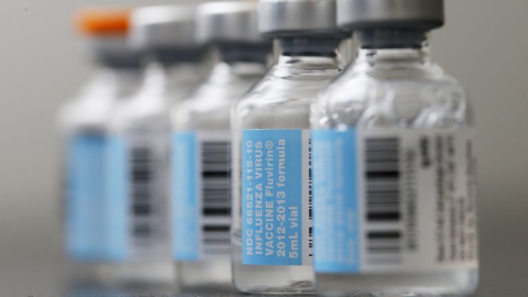 An Associated Press file photo shows vials of flu vaccine (MATT ROURKE/AP)