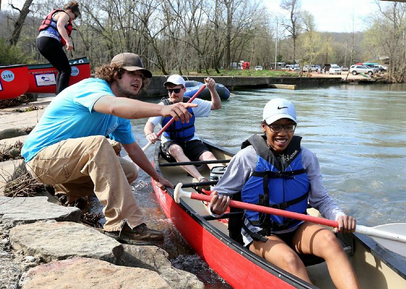 Nathan Spears with the Buffalo Outdoor Center gives some final instructions Thursday to Parker Henry (center) and Ajuania Woodley before they put-in on the Buffalo River at Ponca.
(NWA Democrat-Gazette/David Gottschalk)