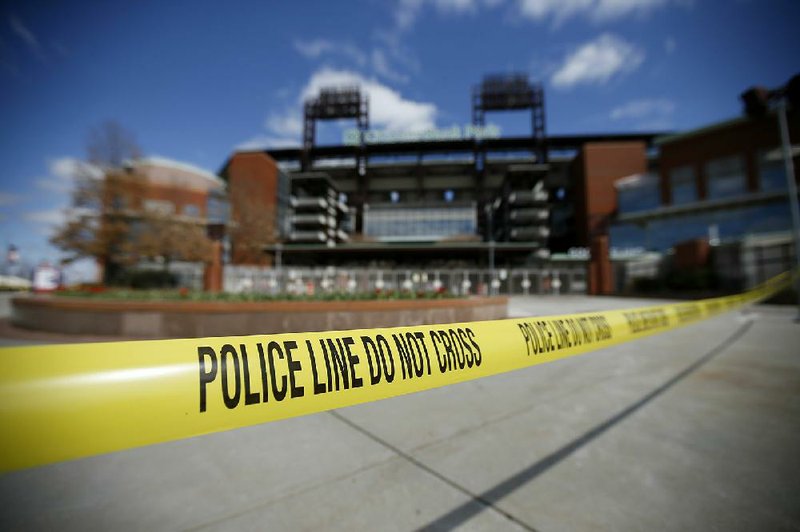 Police tape blocks an entrance to Citizens Bank Park, home of the Philadelphia Phillies. The Major League Baseball season,  which was scheduled to begin Thursday, is on hold because of coronavirus concerns.
(AP/Matt Slocum)