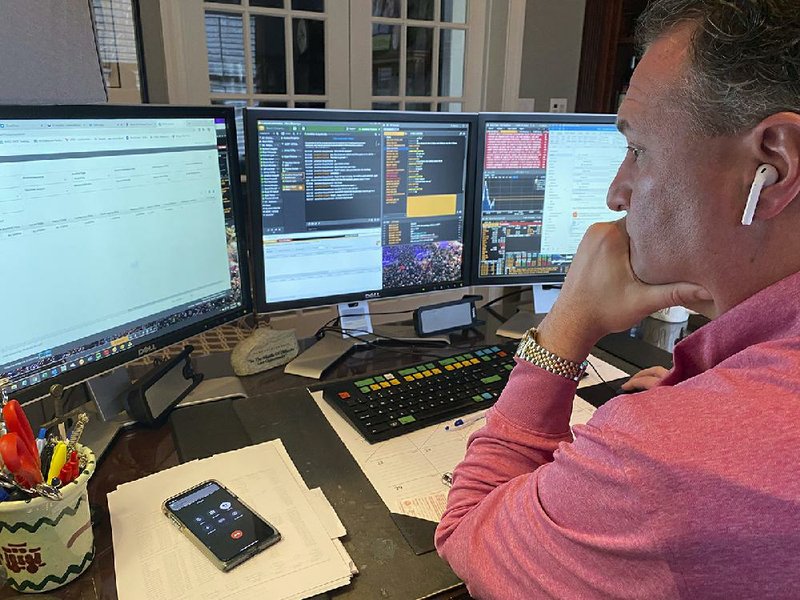 Jonathan Corpina, senior managing partner at Meridian Equity Partners Inc., works in his home office Wednesday in Armonk, N.Y., while the New York Stock Exchange trading floor remains closed.
(AP/Courtesy Jonathan Corpina)