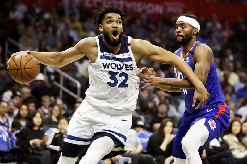 Minnesota Timberwolves center Karl-Anthony Towns (32) said in an Instagram post Wednesday that his mother is in a hospital and on a ventilator in a medically induced coma as she battles the coronavirus.
AP/Craig Lassig