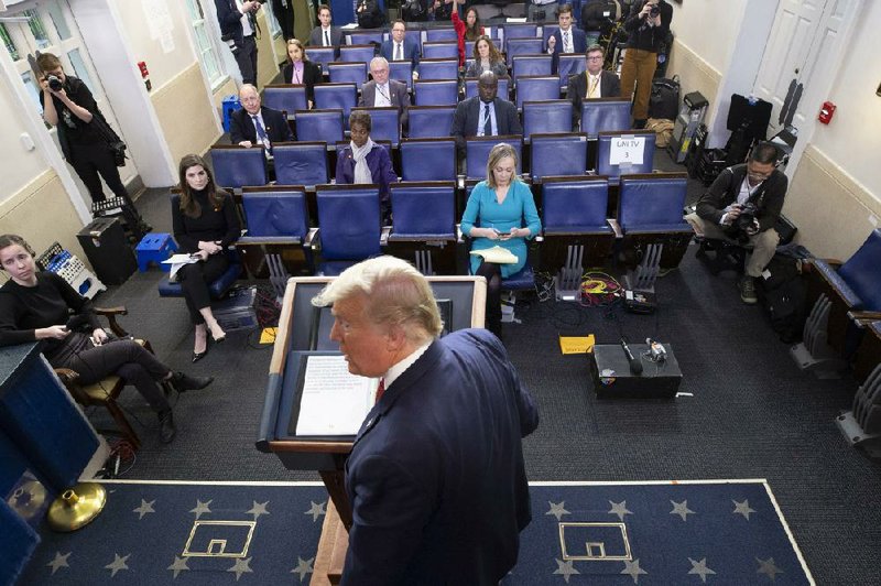President Donald Trump holds a news briefing Wednesday at the White House. Conservative thinkers, pundits and politicians have been sowing arguments to support a potential relaxing of social-distancing policies, something Trump has suggested in recent days.
(AP/Alex Brandon)