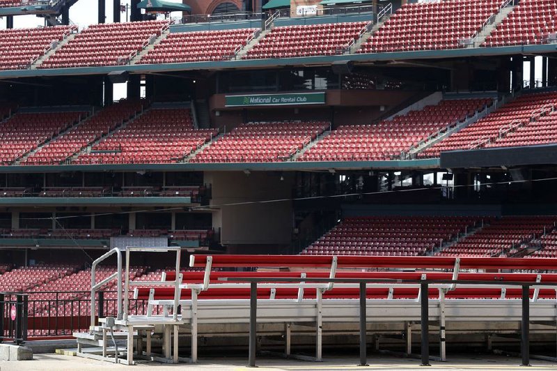 Empty seats are seen inside Busch Stadium in St. Louis on Wednesday. Major League Baseball’s regular season was set to begin today but is on hold indefinitely because of the coronavirus pandemic.
(AP/Jeff Roberson)
