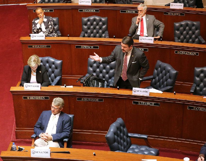 Sen. Jason Rapert, R-Conway, asks a question during debate on  an amendment to the Senate’s covid-19 rainy day fund bill March 26, 2020 during a special session at the state Capitol in Little Rock.
(Arkansas Democrat-Gazette/Thomas Metthe)