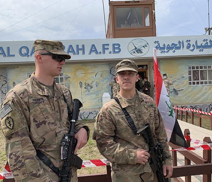 U.S. soldiers stand guard Friday during the hand-over ceremony of the Qayyarah airfi eld near Mosul, Iraq, to Iraqi security forces. The airfield was the second base that U.S.-led coalition troops have withdrawn from as part of a troop decrease in Iraq.
(AP/Ali Abdul Hassan)