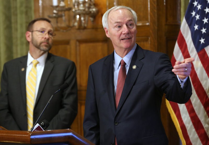 Gov. Asa Hutchinson talks about new funding proposals related to COVID-19 looks on during a press conference on Thursday, March 26, 2020, at the State Capitol in Little Rock. (Arkansas Democrat-Gazette/Thomas Metthe)