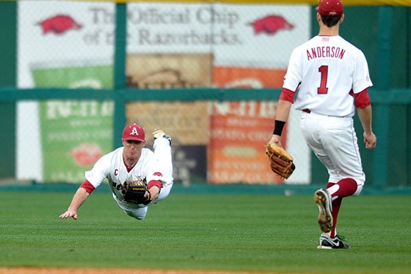 Arkansas' Matt Vinson makes a diving catch during a game against Mississippi State on Friday, March 29, 2013, in Fayetteville.