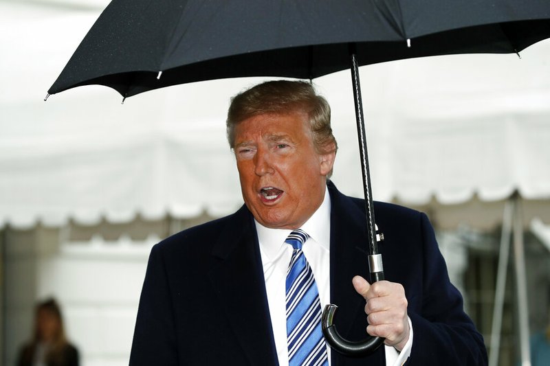 President Donald Trump speaks about the coronavirus as he walks to Marine One to depart the White House, Saturday, March 28, 2020, in Washington. Trump is en route to Norfolk, Va., for the sailing of the USNS Comfort, which is headed to New York.