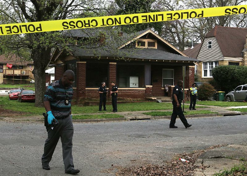 Little Rock police investigate a homicide March 27 in the 2900 block of South Gaines Street.
(Arkansas Democrat-Gazette/Thomas Metthe)