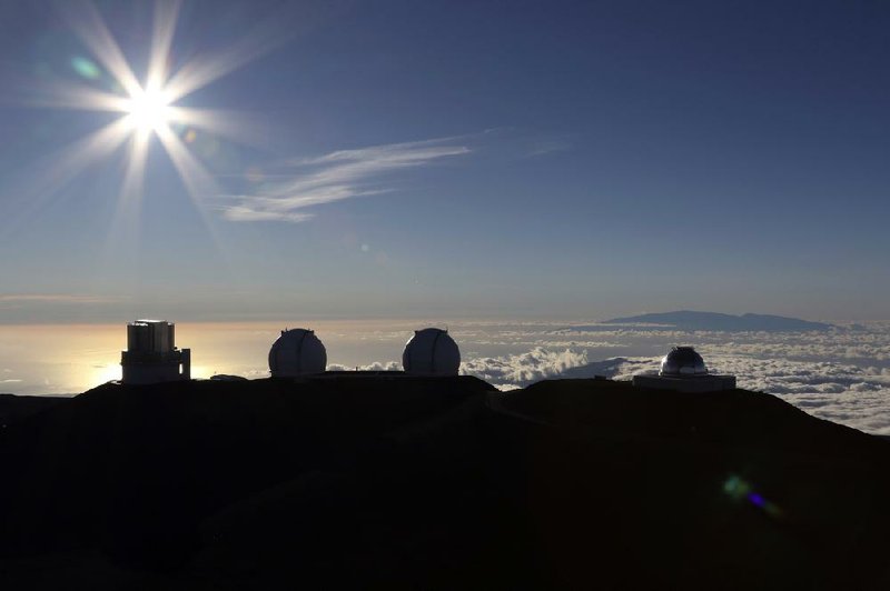 Protesters at the site of the Thirty Meter Telescope project in Hawaii have broken camp to “stay in our bubbles and remain home,” a social media posting said.
(AP/Caleb Jones)