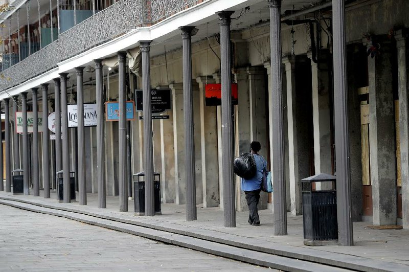 New Orleans’ Jackson Square stands nearly deserted Friday along with the rest of the French Quarter, normally bustling with tourists, as it was during Mardi Gras festivities.
(AP/Gerald Herbert)