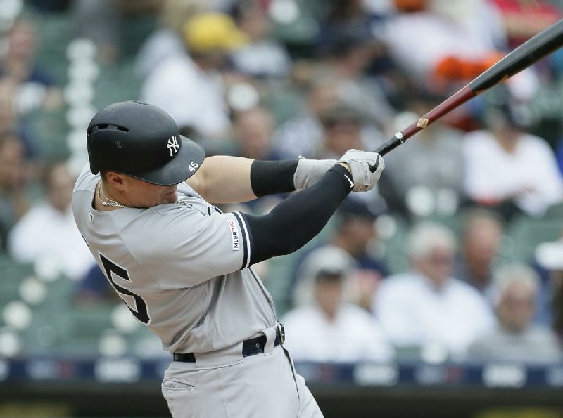 New York Yankees' Luke Voit hits a two-run home run against the Detroit Tigers during the first inning of game one of a doubleheader baseball game, Thursday, Sept. 12, 2019, in Detroit. (AP Photo/Duane Burleson)
