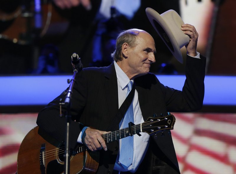 Singer James Taylor tips his hat after performing a song at the Democratic National Convention in Charlotte, N.C., in 2012. (AP Photo/Charles Dharapak)