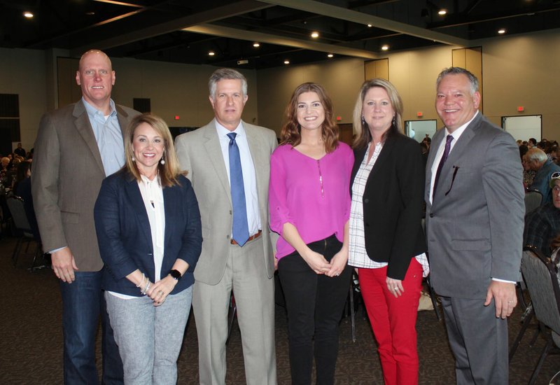 Troy Kestner (from left), Stephanie Lovell, Jim Ed Summers, Kimberly Shepherd, Deena Wright and Coleman Ward represent SWK Financial Planning Advisors of Raymond James, Volunteer Business of the Year, at the Life Styles Reaching New Heights luncheon March 11 at the Fayetteville Town Center. (NWA Democrat-Gazette/Carin Schoppmeyer)