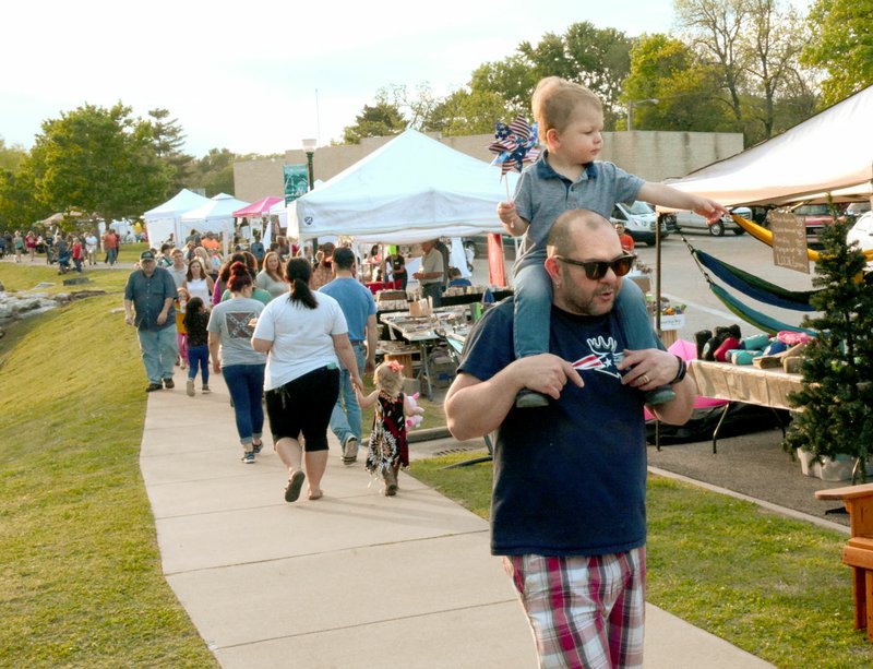 File photo Downtown Crowds fill downtown Siloam Springs during the 2019 Dogwood Festive. The Chamber of Commerce postponed the 2020 Dogwood Festival until May 29, 30 and 31 in response to the coronavirus threat.