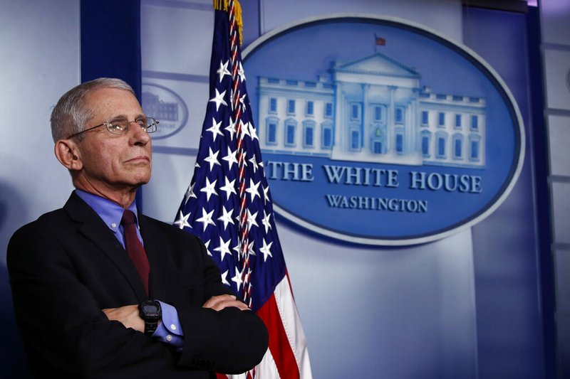 Dr. Anthony Fauci, director of the National Institute of Allergy and Infectious Diseases, listens during a briefing about the coronavirus in the James Brady Press Briefing Room, Friday, March 27, 2020, in Washington.