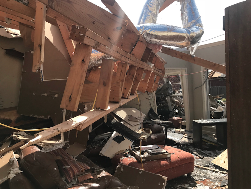 Wreckage litters a Jonesboro home Sunday after a tornado swept through the city on Saturday night, injuring 22 people. 