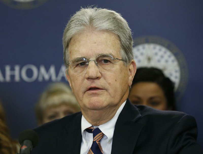 FILE - In this March 28, 2018 file photo, former U.S. Sen. Tom Coburn speaks at a news conference in Oklahoma City. Coburn has died. He was 72. A cousin tells The Associated Press that he died early Saturday, March 28, 2020. 
(AP Photo/Sue Ogrocki, File)