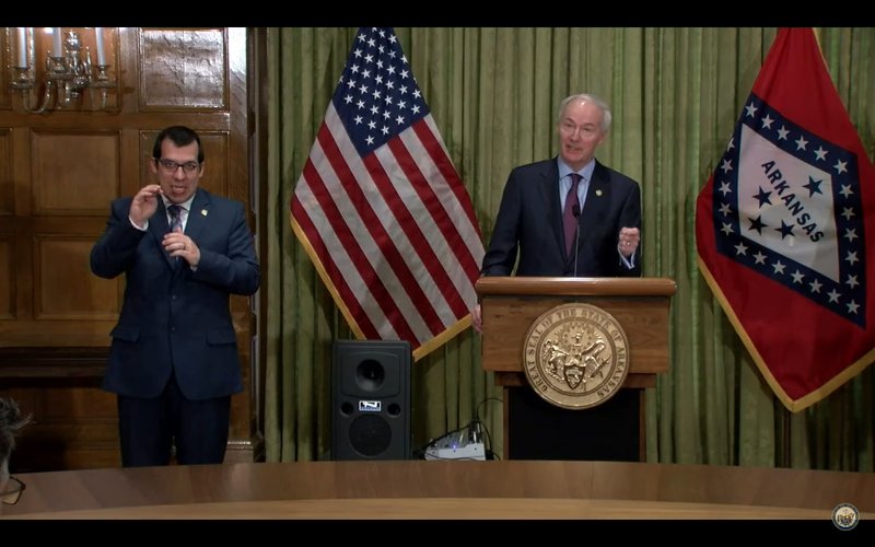 Gov. Asa Hutchinson speaks to reporters during a daily press briefing held at the State Capitol Monday. Not pictured are Secretary of the Department of Health Dr. Nate Smith and Sec. of the Department of Parks, Heritage and Tourism Stacy Hurst, who also appeared a the press conference.