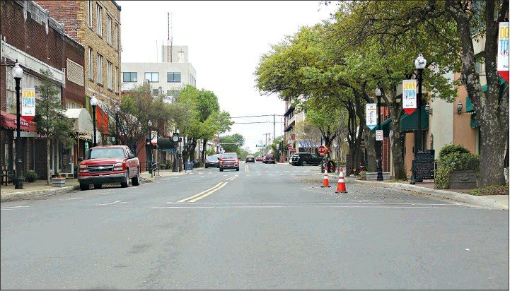 This March 25 photo shows a near-empty Main Street as many retail and hospitality businesses, as well as some service providers, have had to shutter their storefronts or half operations. 