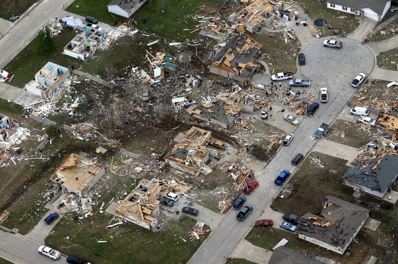 Residents and volunteers continue the cleanup effort Monday in a residential area of Jonesboro hit by Saturday’s EF3 tornado. More photos at arkansasonline.com/331tornado/. (Arkansas Democrat-Gazette/Thomas Metthe) 