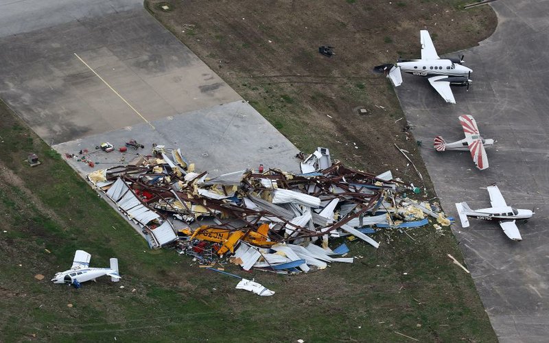 Wrecked airplanes are strewn around a destroyed hangar on Monday, March 30, 2020, from damage caused by Saturday's EF-3 tornado in Jonesboro. 
(Arkansas Democrat-Gazette/Thomas Metthe)