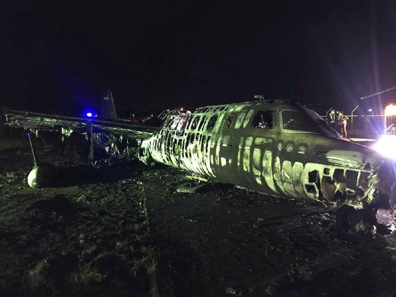The remains of the Westwind 24 aircraft are seen late Sunday after a fatal re at the airport in Manila, Philippines. (AP/MIAA Media Affairs Office) 
