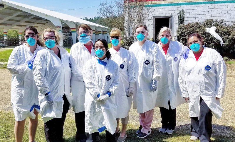 Nurses and medical professionals from local clinics were dressed in full personal protective equipment during a March 26 mass Wuhan virus screening in Columbia County.  Photos submitted by Courtney Bryan-Riddle. 