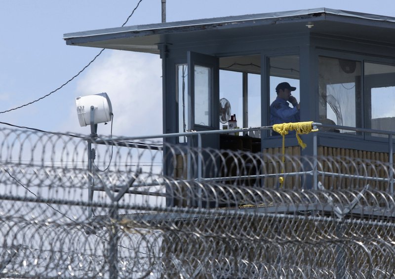 FILE - In this 2011 file photo, a guard sits in a tower at an Arkansas Department of Correction prison.  (AP Photo/Danny Johnston, File)
