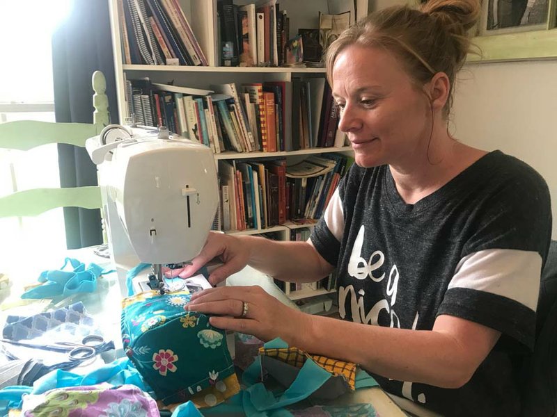 Jenny Wallace, who started the Let’s Sew Face Masks Facebook group, sews masks. The group has about 900 people and sews masks for health care professionals and those on the front lines combating the coronavirus pandemic. story.lead_photo.caption