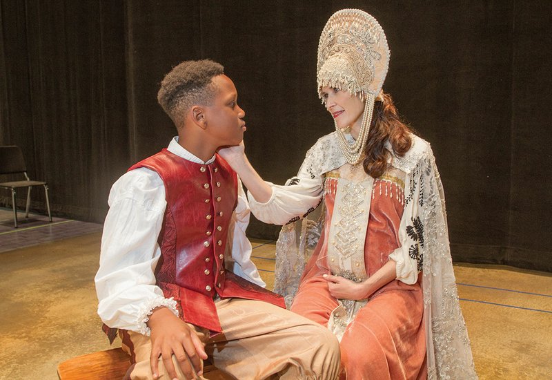 Queen Hermione, played by Paige Reynolds, UCA professor, enjoys a tender moment with her son, Mamillius, played by Aidan Eslinger of Conway, in this rehearsal scene from the play performed by the Arkansas Shakespeare Theatre at the University of Central Arkansas in Conway.