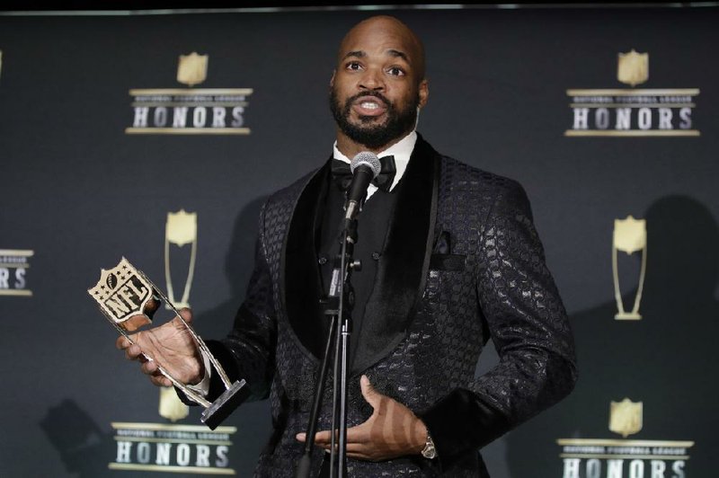 Washington Redskins' Adrian Peterson speaks after winning the Art Rooney Sportsmanship Award at the NFL Honors football award show Saturday, Feb. 1, 2020, in Miami. (AP Photo/Patrick Semansky)