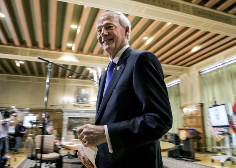 Governor Asa Hutchinson departs a press conference Tuesday March 31, 2020 about the corona virus in Arkansas in Little Rock.
(Arkansas Democrat-Gazette/ John Sykes Jr.)