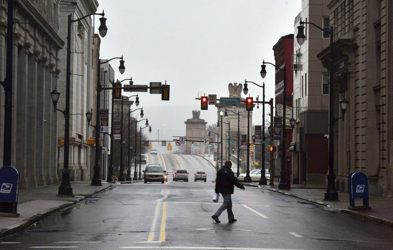 Businesses are closed and very few people are out in downtown Wilkes-Barre, Pa., Monday, March 23, 2020, heeding the advice of Gov. Tom Wolf. (Aimee Dilger/The Times Leader via AP)