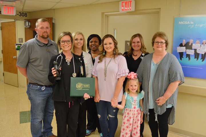 Jennier Sharp, second from left, an RN in the ICU at the Medical Center of South Arkansas, was recognized recently with a DAISY Award for Extraordinary Nurses. 